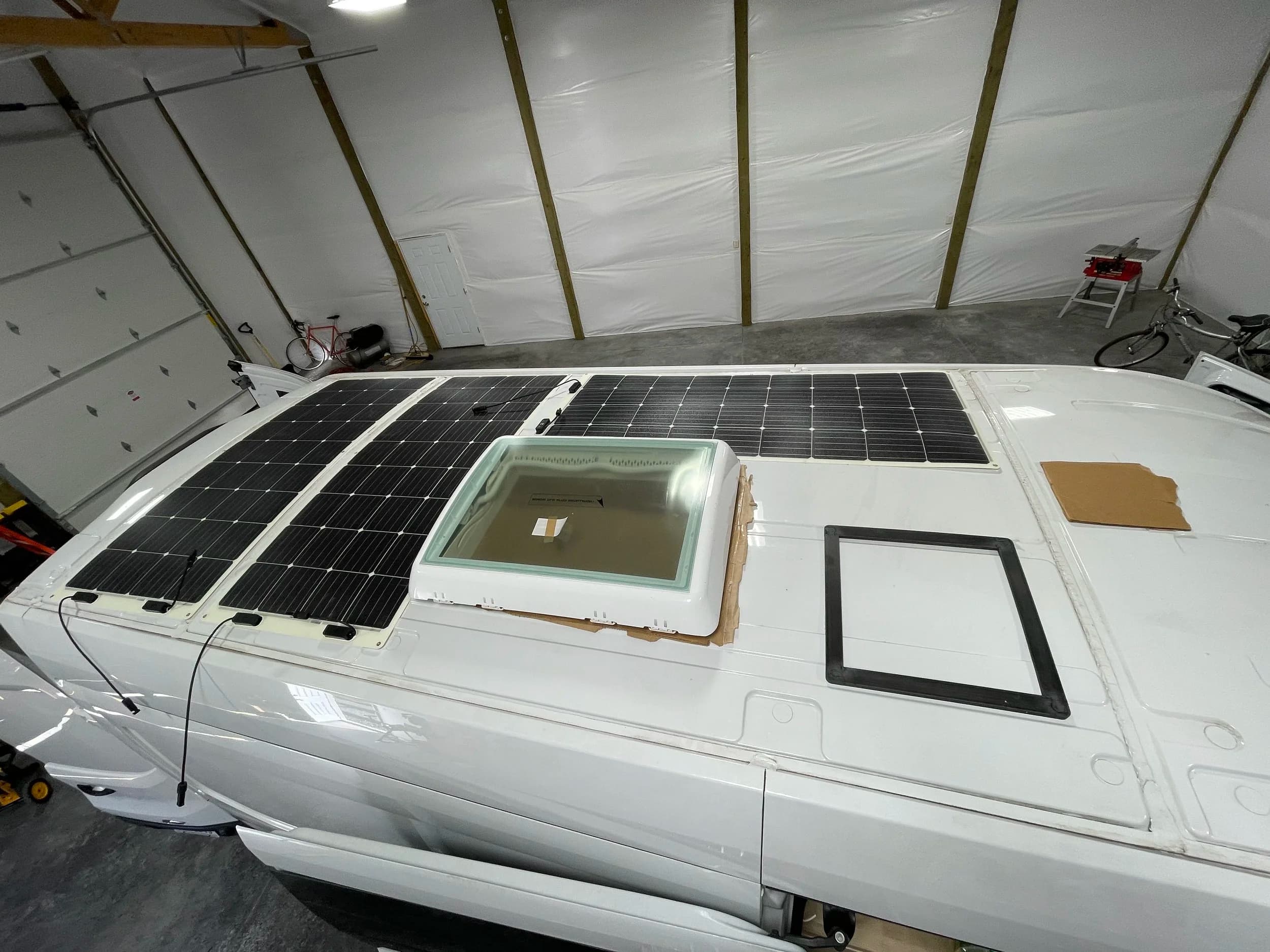 Rooftop solar panels and large skylight installation