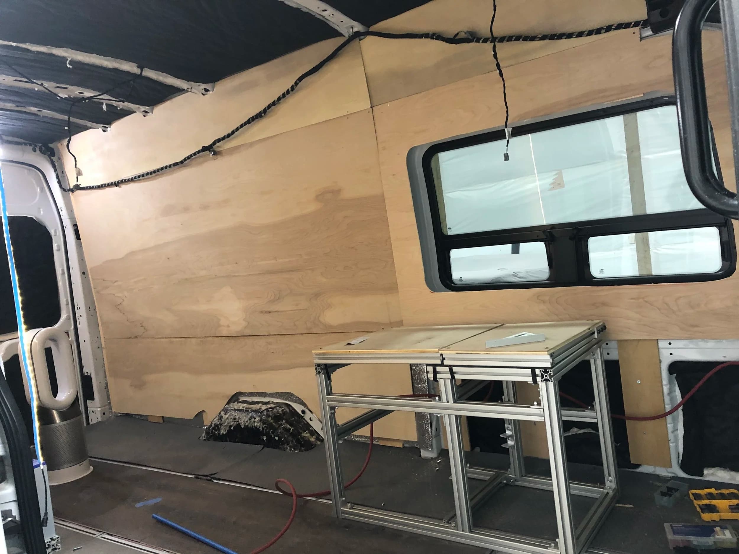 Installing birch plywood wall panels over insulation